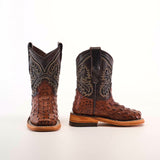 The Caiman Hornback Print Chocolate Square Toe boots exhibit Western style with detailed stitching and crocodile texture. One boot stands upright, the other lies on its side against a white background. The light brown soles have a slight heel, enhancing their rugged charm.