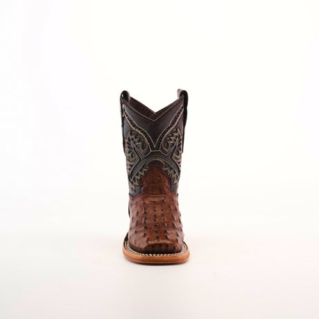 The Caiman Hornback Print Chocolate Square Toe cowboy boot is set against a white background, highlighting its exquisite leather craftsmanship with intricate stitching on the dark upper and a brown textured lower section, complete with a wooden sole, epitomizing authentic Western style.