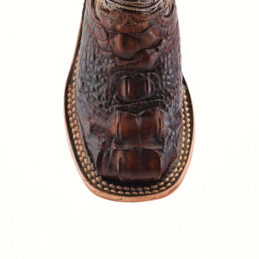 The Alligator Head Print Rustic Honey Square Toe cowboy boot features a scaly pattern with intricate stitching, crafted from premium brown leather. Its square toe design and light-colored sole highlight its western fashion and handcrafted allure.