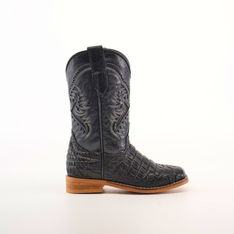 The Caiman Belly Print Black Square Toe boot is showcased solo against a white backdrop, featuring intricate stitching and a wooden sole, making it perfect for cowboy enthusiasts with its classic Western silhouette.