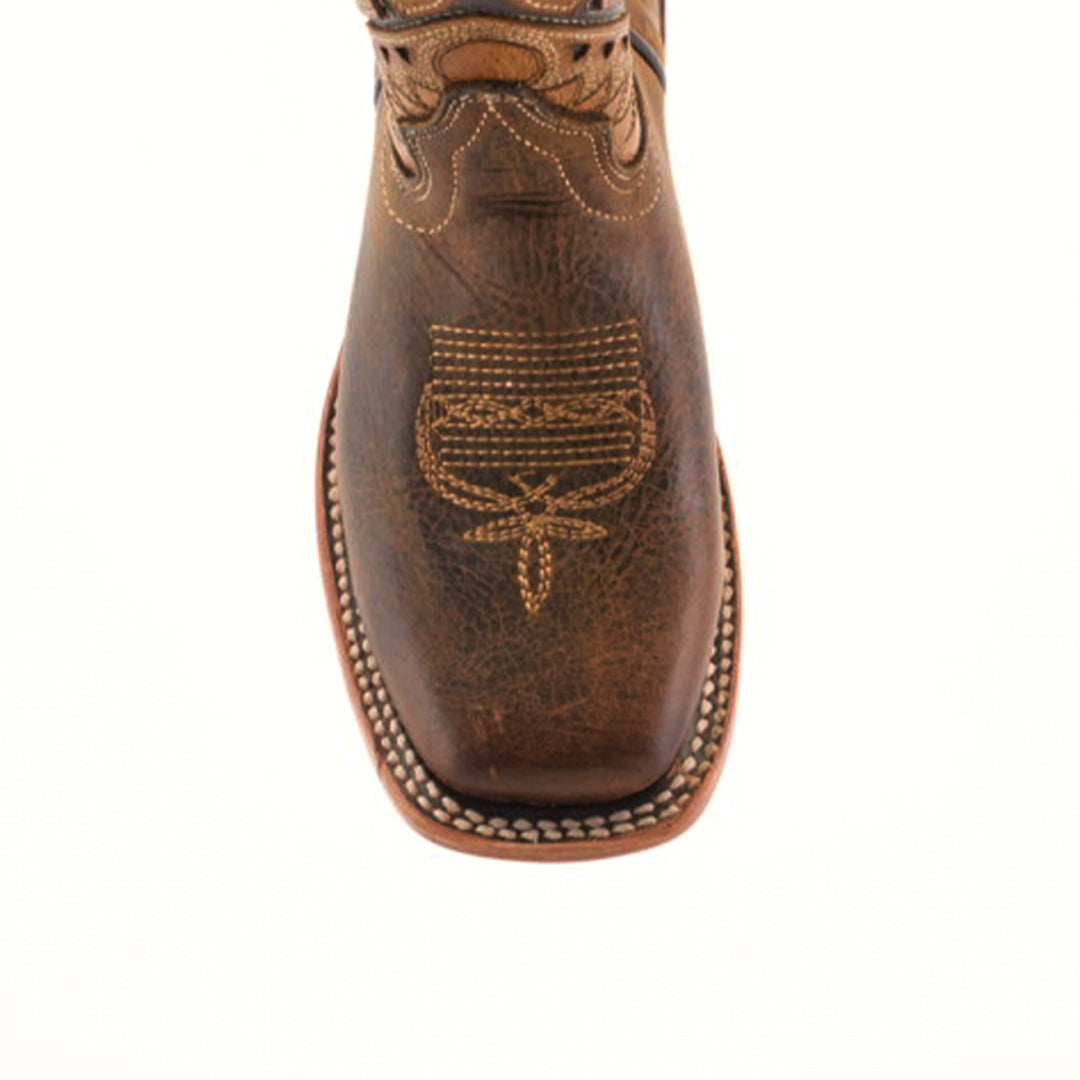 The Azkar Tan Square Toe cowboy boot features handcrafted cowhide leather with intricate white stitching on the toe and a decorative pattern. It has a rugged texture with a light brown sole, highlighted by visible white stitching around the edge for a refined look.