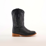 The Stingray Half Cowhide Print Black Rodeo Toe boot showcases intricate Western stitching, a textured cowhide leather lower, and a wooden sole with a low heel, all captured from the side against a plain white background.