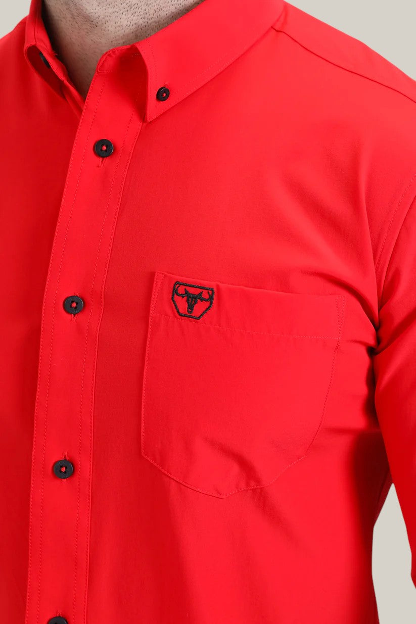 A man wearing the CTL10700 Men’s Single Pocket Logo Modern Fit Stretch Dress Shirt in red, showcasing a sleek design with a black bull logo on the chest pocket.