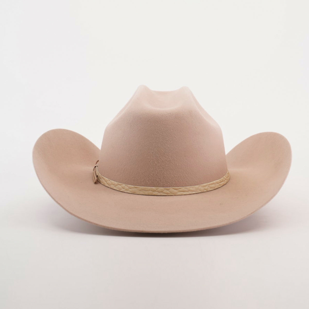 Discover the allure of the 6X Bull Belly, a luxurious tan cowboy hat with a wide brim and braided band around the crown, beautifully presented against a plain white background.