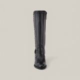 The Denali Crystals Tall Shaft Black Round Toe boot, from the Platinum Collection, is a black knee-high leather design with decorative studs along the seams. It features a side zipper and low heel, showcased against a plain background.