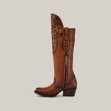 The California Tall Shaft Honey - Round Toe is a brown leather cowboy boot with a mid-height heel, decorative cut-out patterns, and a side zipper. Part of our Platinum collection, it elegantly stands on a neutral background.