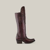 The California Tall Shaft Brown - Round Toe from the Platinum Collection is a dark brown leather cowboy boot featuring intricate shaft stitching, low heel, and round toe. Seen in a side view against a light background, it exudes elegance and style.