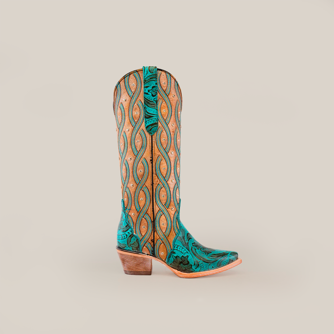 The Premier Turquoise Handtooled Flowers boot features a tall shaft and snip toe with a green and tan pattern, swirling designs, turquoise hand-tooled flowers, and decorative studs on premium-quality leather.