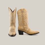 The Cowhide Hortus Rustic White boots, with a mid shaft and round toe, are crafted from cowhide leather in light brown. Showcasing intricate stitching, the left boot angles forward and the right displays its side profile with a moderately sized black heel. They offer timeless craftsmanship for any collection.