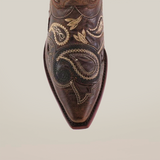 The Etnia Tabaco Short Shaft Snip Toe boots are stylish womens brown leather footwear featuring intricate light-colored floral and paisley embroidery. With a pointed toe design and vintage finish, they showcase exquisite leather craftsmanship.