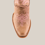 A top view of the Bellere Fawn - Snip Toe boot highlights its premium cowhide leather, intricate pink embroidery on the toe, and light brown sole. The symmetrical floral or scroll design stands elegantly against a plain white backdrop.