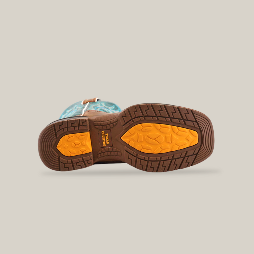 The image displays the sole of the Rustic Turquoise Brown - Waterproof - Soft Toe cowboy boot, featuring a ridged brown pattern with a distinct yellow grip section. The premium cowhide leather boots turquoise upper with a white pattern is partially visible.