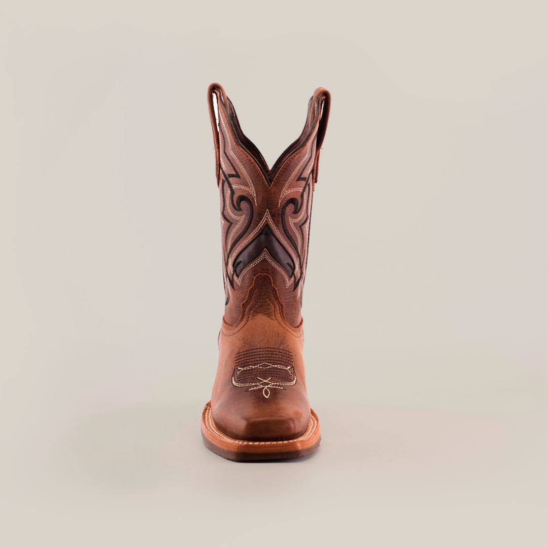 The Fresno Shedron Slip Resistant Sole Rodeo Toe cowboy boot features intricate stitching and pull tabs on both sides. Its showcased with a rodeo toe against a plain white background.