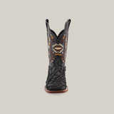 The Exotic Pirarucu Fish Patchwork Matte Black Square Toe boot features intricate orange, brown, and white embroidery. Crafted from authentic leather, it boasts a textured lower section with contrasting shaft stitching against a plain white backdrop.