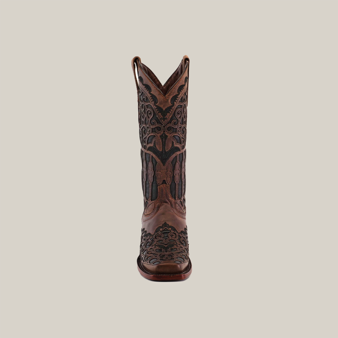 The Taurine Chocolate Mid Shaft cowboy boot, with a Narrow Square Toe, features intricate stitching and handcrafted luxury on premium brown leather. The decorative designs enhance its elegance, set against a plain white background.