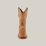 The Sierra Fawn - Square Toe boot, made from premium cowhide leather, is adorned with decorative stitching on the shaft and stands elegantly against a plain white background, showcasing exceptional craftsmanship.