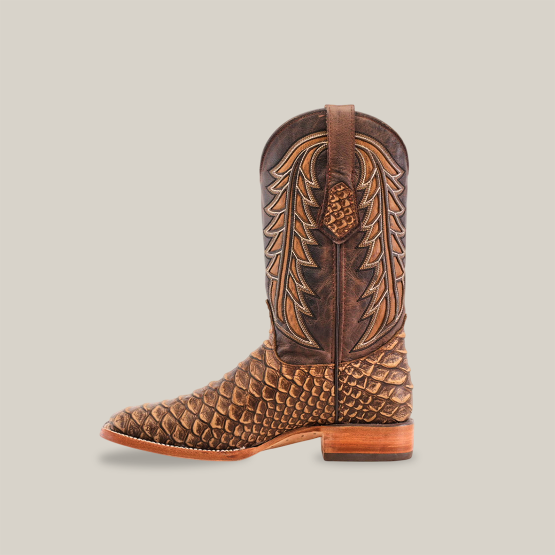 A single Jumbo Python Print Cappuccino cowboy boot, featuring an intricate scale and leaf-pattern design, crafted from premium cowhide leather with a wooden heel and top pull tab. This masterpiece of handcrafted artisanship is photographed on a white background.