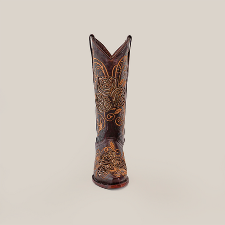 The Rosal Chocolate Mid Shaft Snip Toe boot, featuring detailed yellow floral embroidery on quality leather, stands out against a white backdrop. This handcrafted Western piece highlights the elegance and artistry of traditional design.