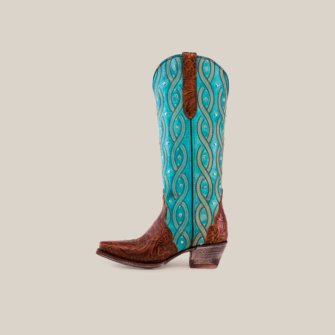 The Premier Tabaco Handtooled Flowers boots feature a brown leather foot, a tall turquoise shaft with swirl patterns, an angled heel, decorative stitching for Western elegance, and floral tooling similar to the design. They are shown upright on a white background.