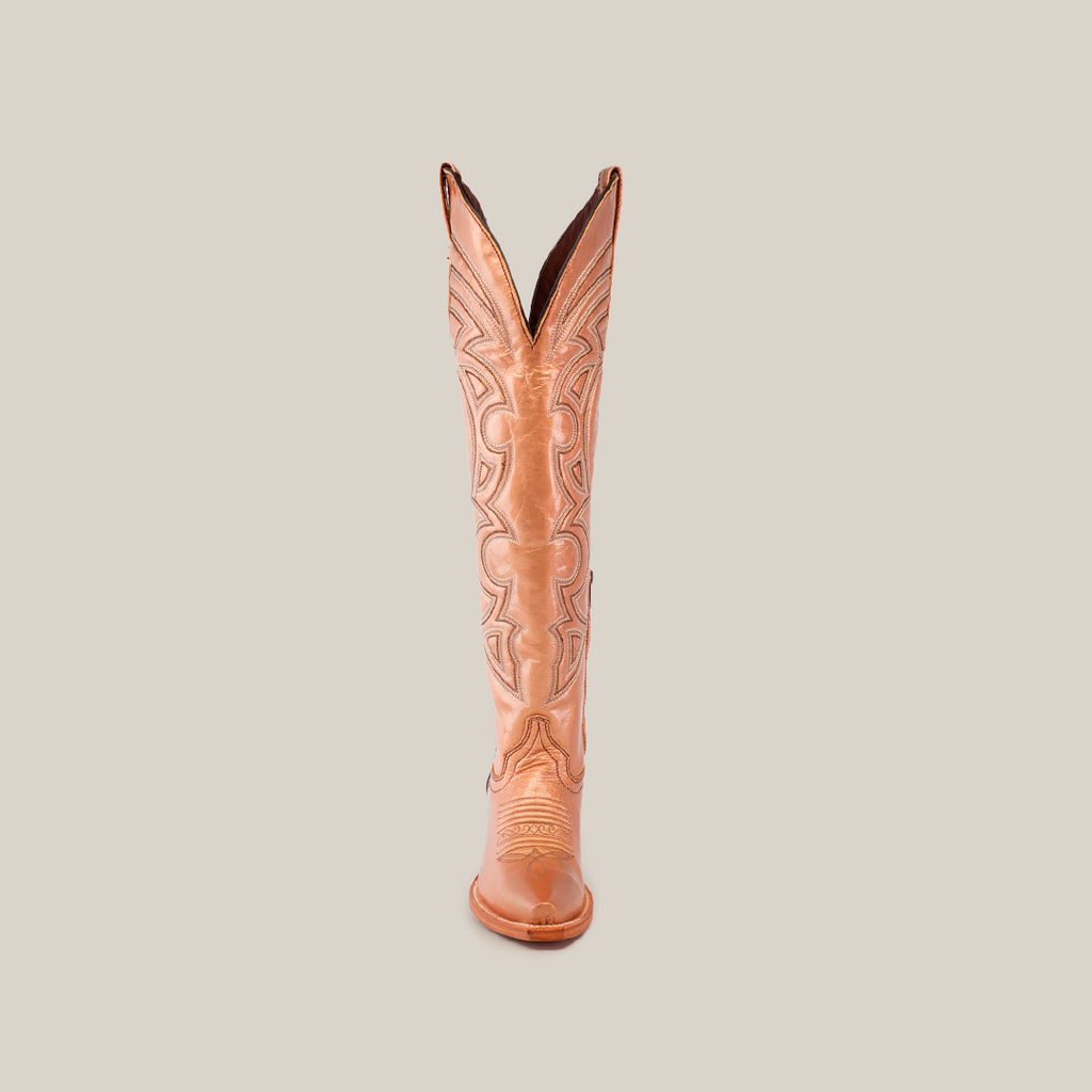 Front view of the Taylor Rose Gold tall shaft cowboy boot in tan featuring intricate stitching and a slightly pointed snip toe, set against a white background.