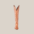 Front view of the Taylor Rose Gold tall shaft cowboy boot in tan featuring intricate stitching and a slightly pointed snip toe, set against a white background.
