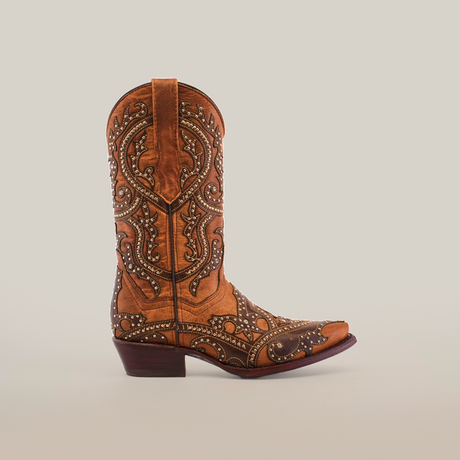 The Nirvana Tabaco - Short Shaft - Snip Toe womens boot exudes a Western style with intricate embroidery and ornamental swirls, featuring a medium heel and pointed toe against a plain white background.