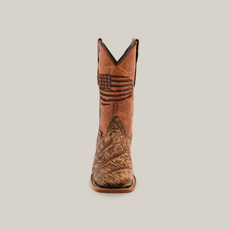 A single American Alligator Print Rustic Orix boot is centered against a white background. The brown square-toe cowboy boot features an engraved American flag on the upper shaft and has a classic leather sole.