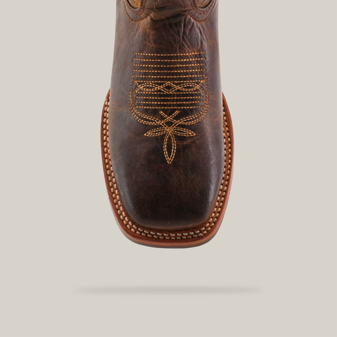 A top view of the Azkar Tan cowboy boot featuring a square toe with intricate yellow stitching on premium cowhide and a slip-resistant sole, styled against a plain light-colored background to blend style and functionality.