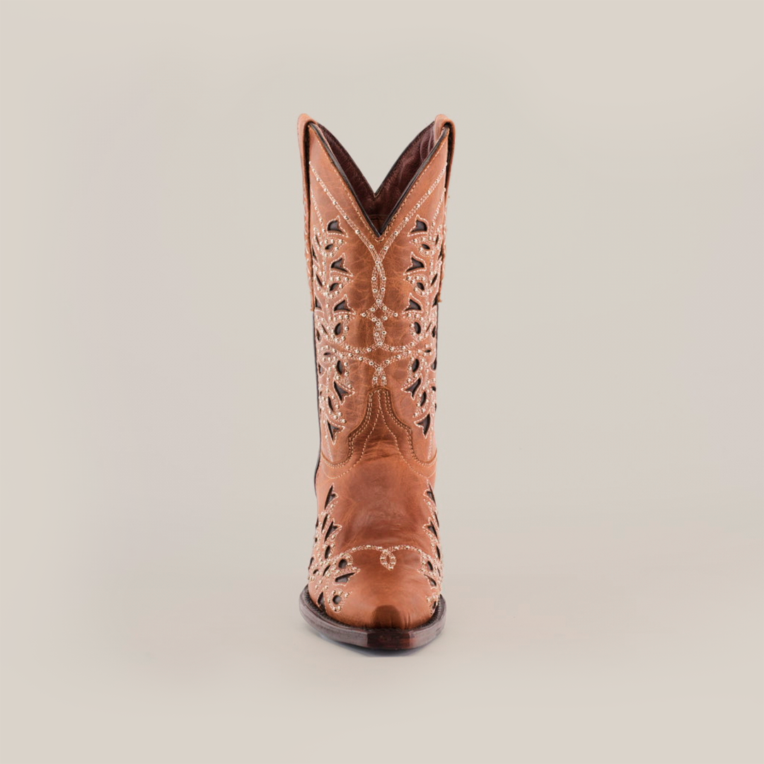 The Flipy Honey - Short Shaft - Snop Toe cowboy boot, centered on a white backdrop, showcases intricate cutout patterns and stitching from the front. This womens boot exemplifies quality craftsmanship with its premium leather sole, highlighting traditional bootmaking artistry.