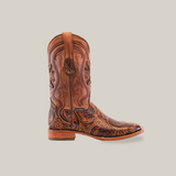 The Handtooled Leave Orix - Square Toe cowboy boot in brown showcases a premium cowhide build with ornate floral and swirl patterns. Featuring a medium heel, loop for easy wear, and textured leather, it embodies the distinctive Handtooled artistry.