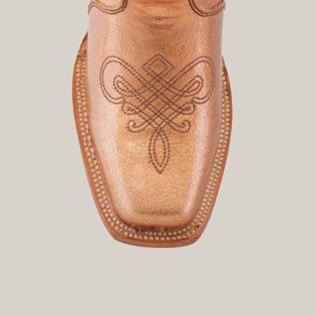 The Eden Rose Gold boot showcases a narrow square toe in elegant light brown leather with intricate black stitching and a stitched welt, embodying refined style against a plain white backdrop.