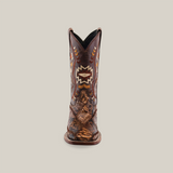 The Exotic Python Patchwork Brown Square Toe boot is crafted from luxurious python leather, featuring intricate stitch patterns and reptilian texture details on the toe and heel. This exotic masterpiece stands upright against a plain white background.