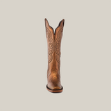 A single brown Eden Copper Tall Shaft boot with intricate embroidery on the shaft and toe, crafted from premium leather, stands upright against a plain white backdrop, facing forward to showcase its detailed design and luxurious craftsmanship.