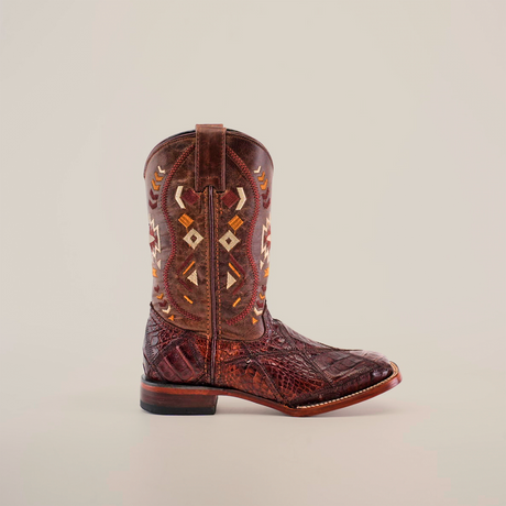 The Exotic American Alligator Patchwork Brown Square Toe boot is depicted on a white background, showcasing intricate geometric and arrow embroidery. It features a rugged texture and low heel, crafted from genuine alligator skin for an exotic appeal.