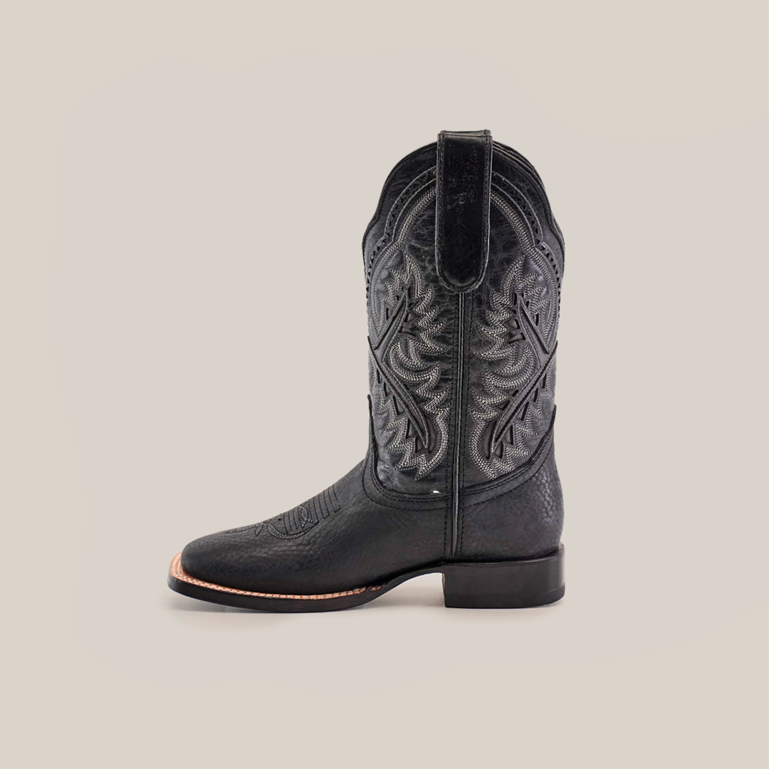 A single Cheyenne Black Square Toe boot, seen from the side, features intricate stitching, a sleek square toe, and is crafted from premium leather. It showcases traditional Western style with a low heel and decorative shaft patterns.