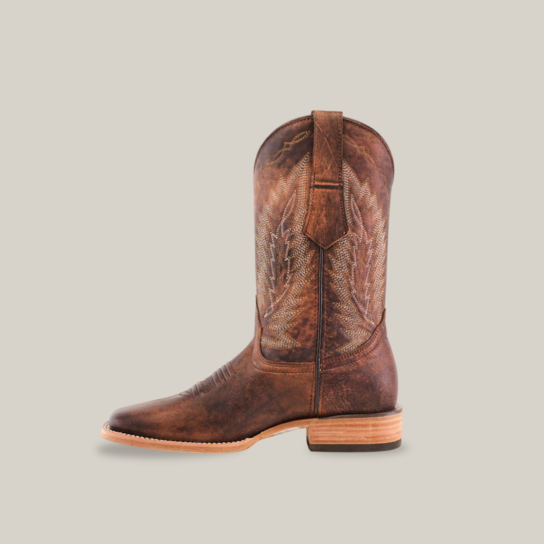 The Bombay Camel - Square Toe cowboy boot features premium cowhide leather with decorative stitching on the shaft over a plain white background, a wide slightly sloped heel, and a pull tab for convenience.