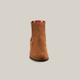 Front view of a Prime Suede Sand Round Toe boot, showcasing a single tan suede ankle boot with red plaid lining on a plain white background.