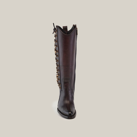 The Francia Rings Tall Shaft Chocolate - J Toe boot is made from premium leather, standing tall in dark brown. This luxury boot features decorative chain links on the side and a small loop at the top for easy wear.