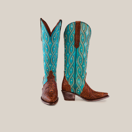 The Premier Tabaco Handtooled Flowers - Tall Shaft - Snip Toe boots showcase intricate blue and turquoise floral tooling on the shafts with brown leather vamps, pointed toes, stacked heels, and a stylish Western flair against a white background.