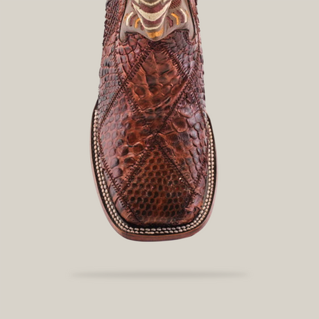 Front view of the Exotic Python Patchwork Chocolate Square Toe boot, showcasing intricate stitching and a scaly python leather pattern. Set against a plain white background, it highlights the detailed craftsmanship and unique design.