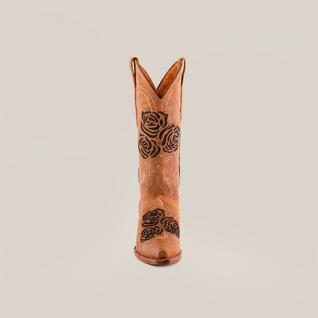 The Rosal Fawn Mid Shaft boot exudes handcrafted elegance, featuring premium leather with exquisite black rose floral embroidery. It stands elegantly on a plain white background, embodying style and sophistication.