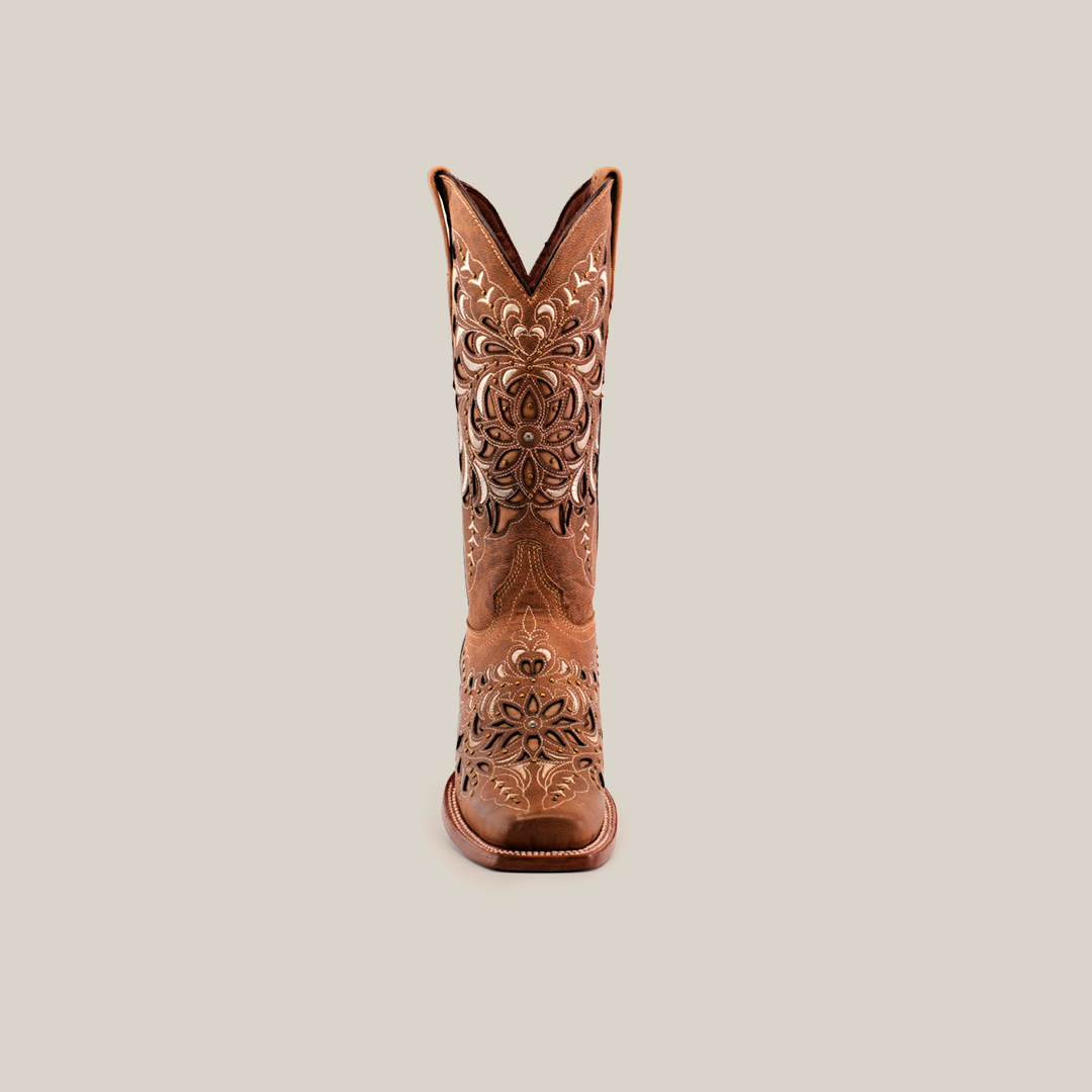 The Kiara Crystals Fawn boot, with a mid shaft and narrow square toe, showcases intricate white embroidery of floral and swirl patterns across the shaft, vamp, and toe on premium leather. Displayed against a white background, these chic brown cowboy boots add elegance to classic Western design.