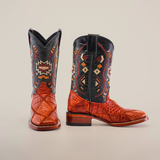 The Exotic American Alligator Patchwork Cogñac Square Toe boots feature black shafts and brown textured alligator leather feet, adorned with colorful geometric embroidery like diamonds and abstract shapes. These cognac boots seamlessly combine classic style with modern flair.