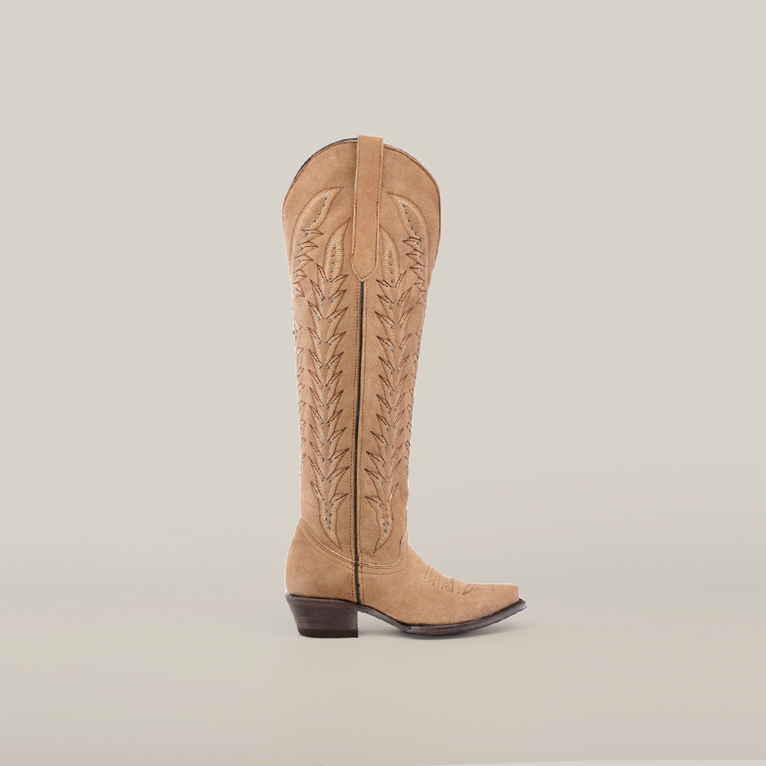 A tall-shaft, snip-toe Madona Sand Suede cowboy boot with intricate stitching is showcased from the side against a plain white background.