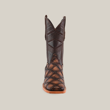 Front view of the Big Bass Pirarucu Print Rustic Brown cowboy boot, showing textured scales and intricate shaft patterns, set against a plain white background.