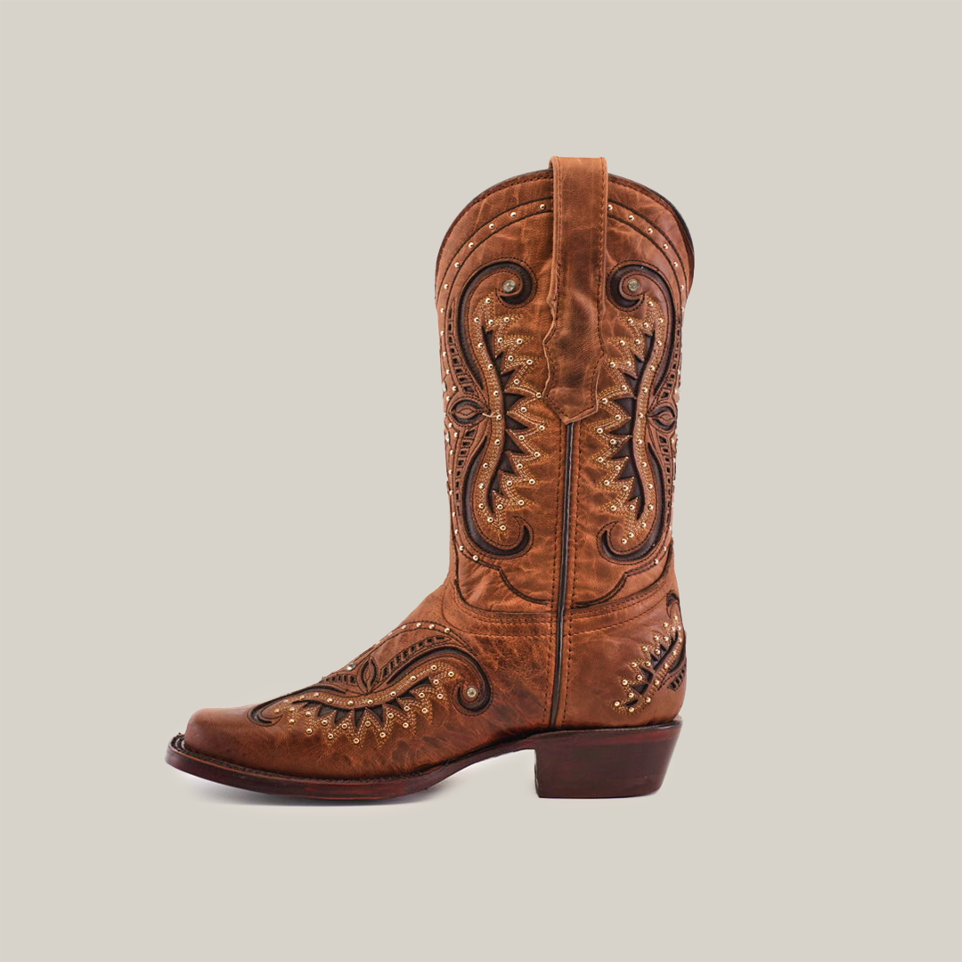 The Croella Orix Crystals boot, a short-shaft, narrow square toe design, is featured on a white background. This brown leather cowboy boot is handcrafted with intricate stitching and decorative designs, complemented by a low heel for an elegant touch suitable for any occasion.