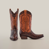 A pair of Handtooled Flowers Brown boots highlights premium leather with intricate stitching and patterns. One boot stands upright, while the other leans slightly against a plain white background, embodying handcrafted elegance.