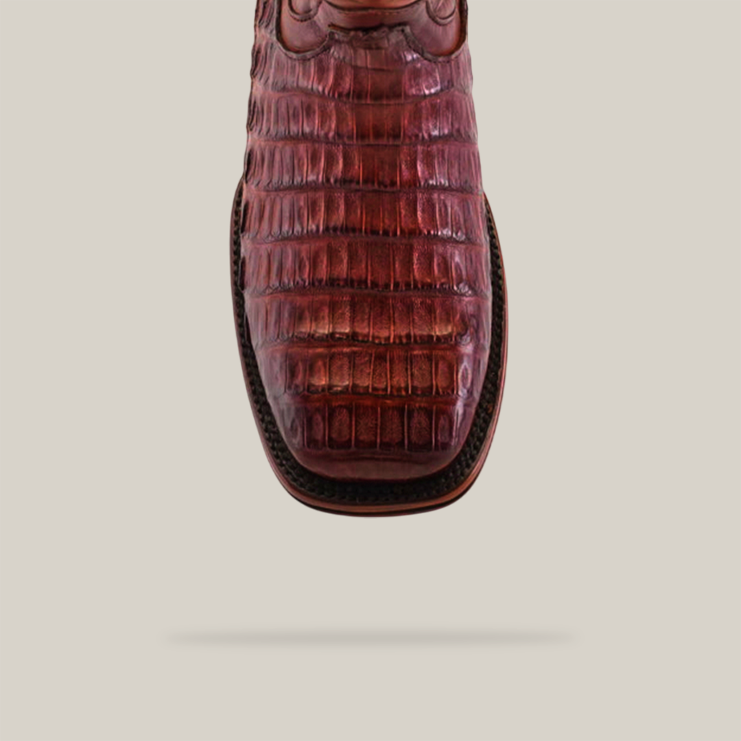 Close-up of an Exotic Caiman Belly Tail - Diamond - Brandy - Square Toe boot with a caiman belly texture and Goodyear welt sole, viewed from above against a plain white background.