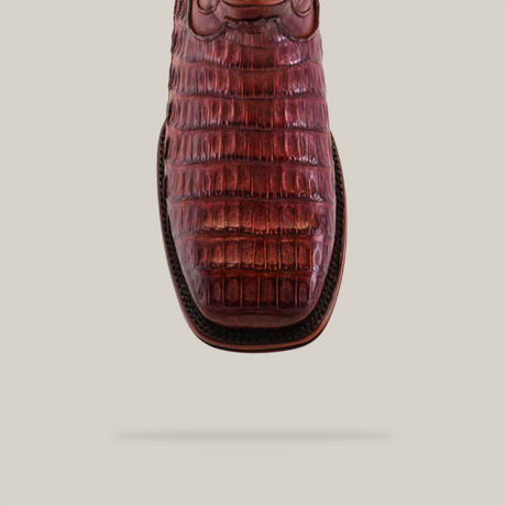 Close-up of an Exotic Caiman Belly Tail - Diamond - Brandy - Square Toe boot with a caiman belly texture and Goodyear welt sole, viewed from above against a plain white background.