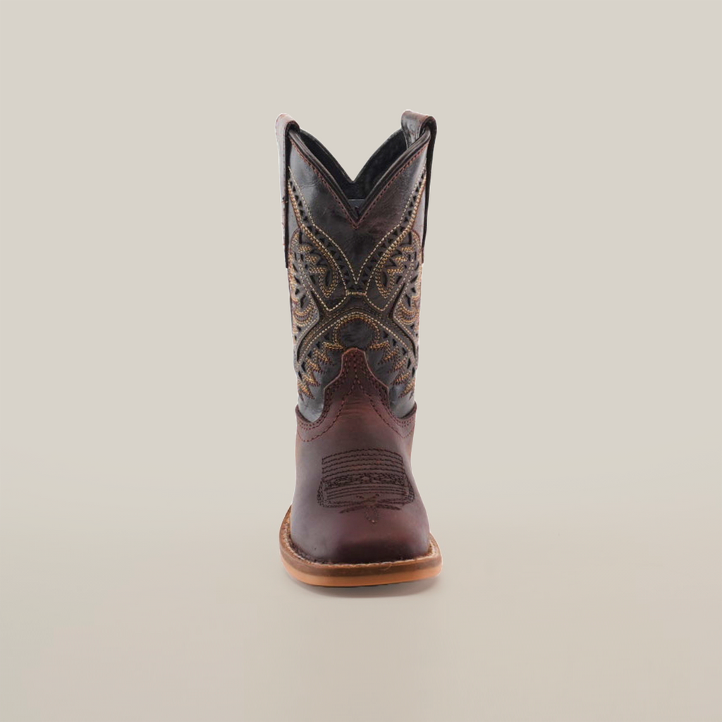 Front view of the Salvage Almond Square Toe, a single brown cowboy boot made from premium cowhide leather, showcasing intricate stitching and a pointed toe, set against a plain white background.